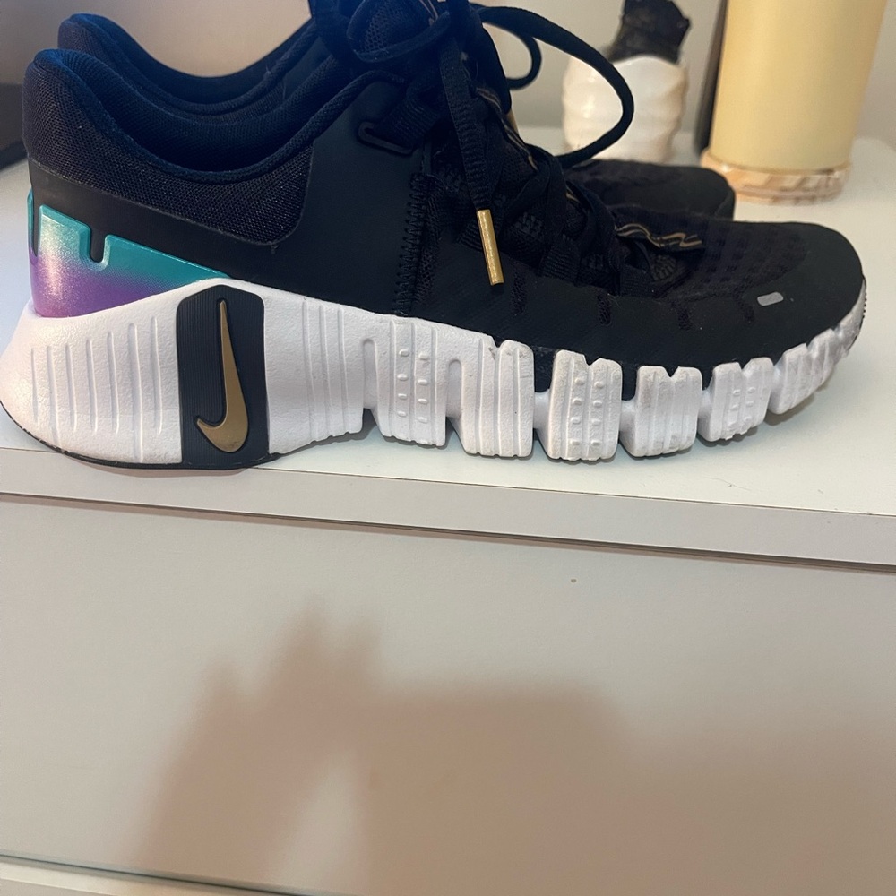 Nike Metcon Black and Gold Sneakers with Modern Design